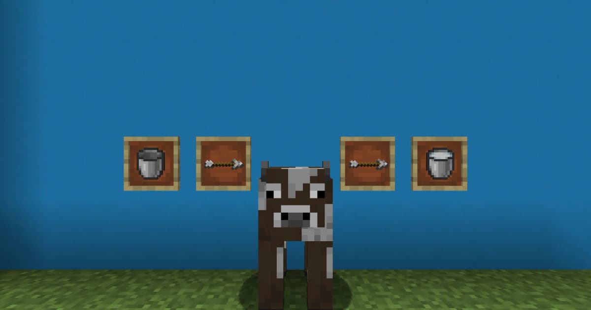 Craft a bucket using 3 iron ingots. Find a cow. Right-click the cow while holding the bucket.