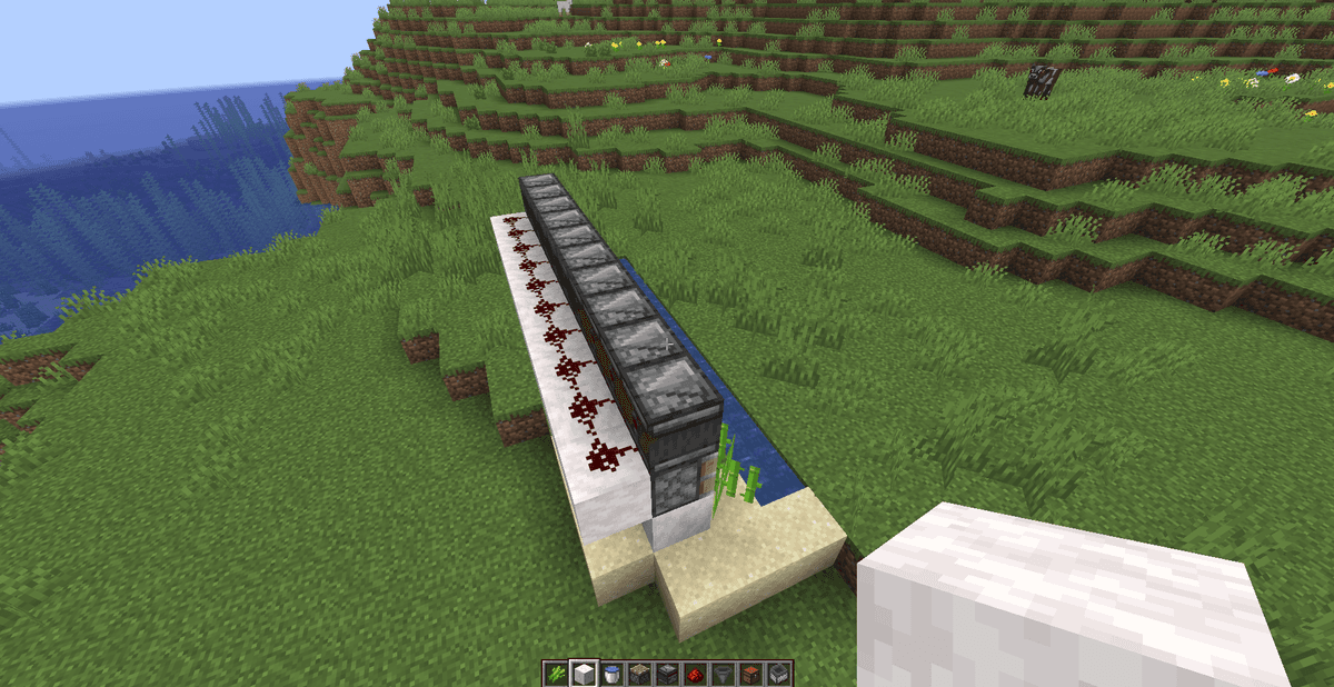 Behind the pistons, directly below the observers, place a row of 10 solid building blocks.Place one piece of Redstone Dust…