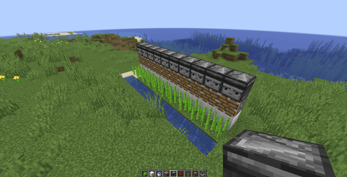 Behind the planted sugar cane, build a wall of solid building blocks one block high (directly above the water line).Install…